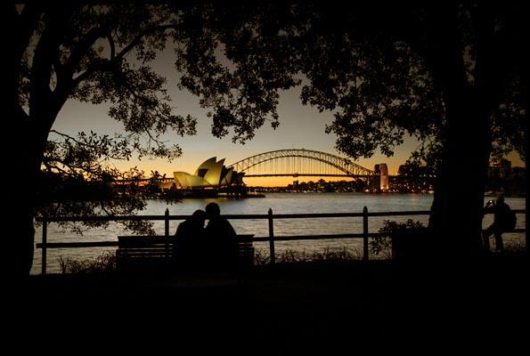 Lovers at Opera House and Harbour Bridge at dusk
