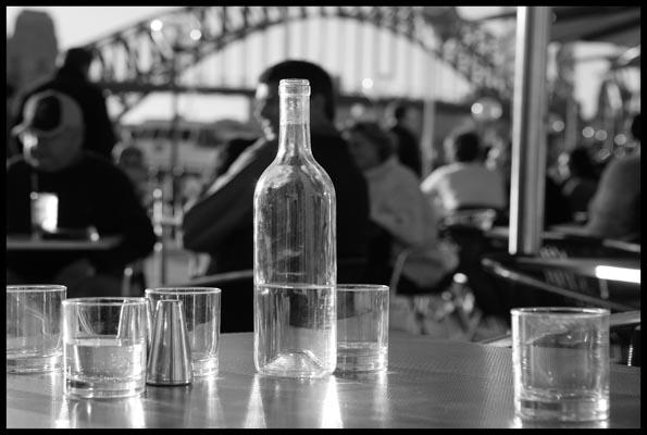 Café and drinks of water ay Circular Quay before a backdrop of the Harbour Bridge