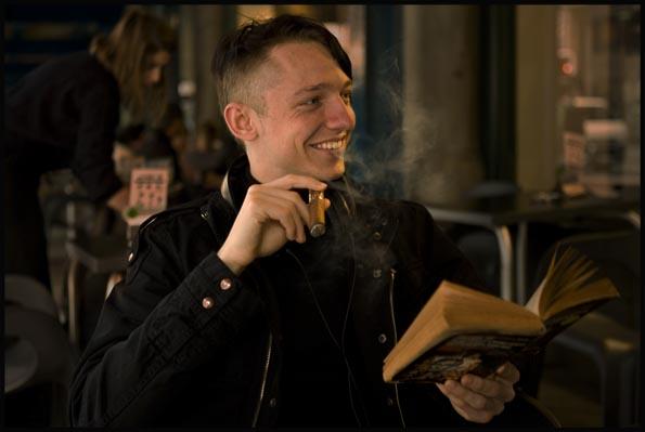 a Cigar smoker reading a book at Jet café in the QVB