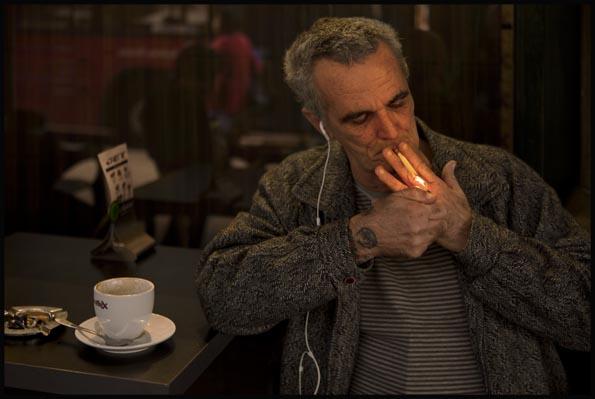 a Cigarette smoker lighting up at Jet café in the QVB