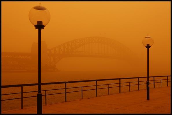 obscured Harbour Bridge and two street lamps in Sydney's dust storm of 23 September 2009